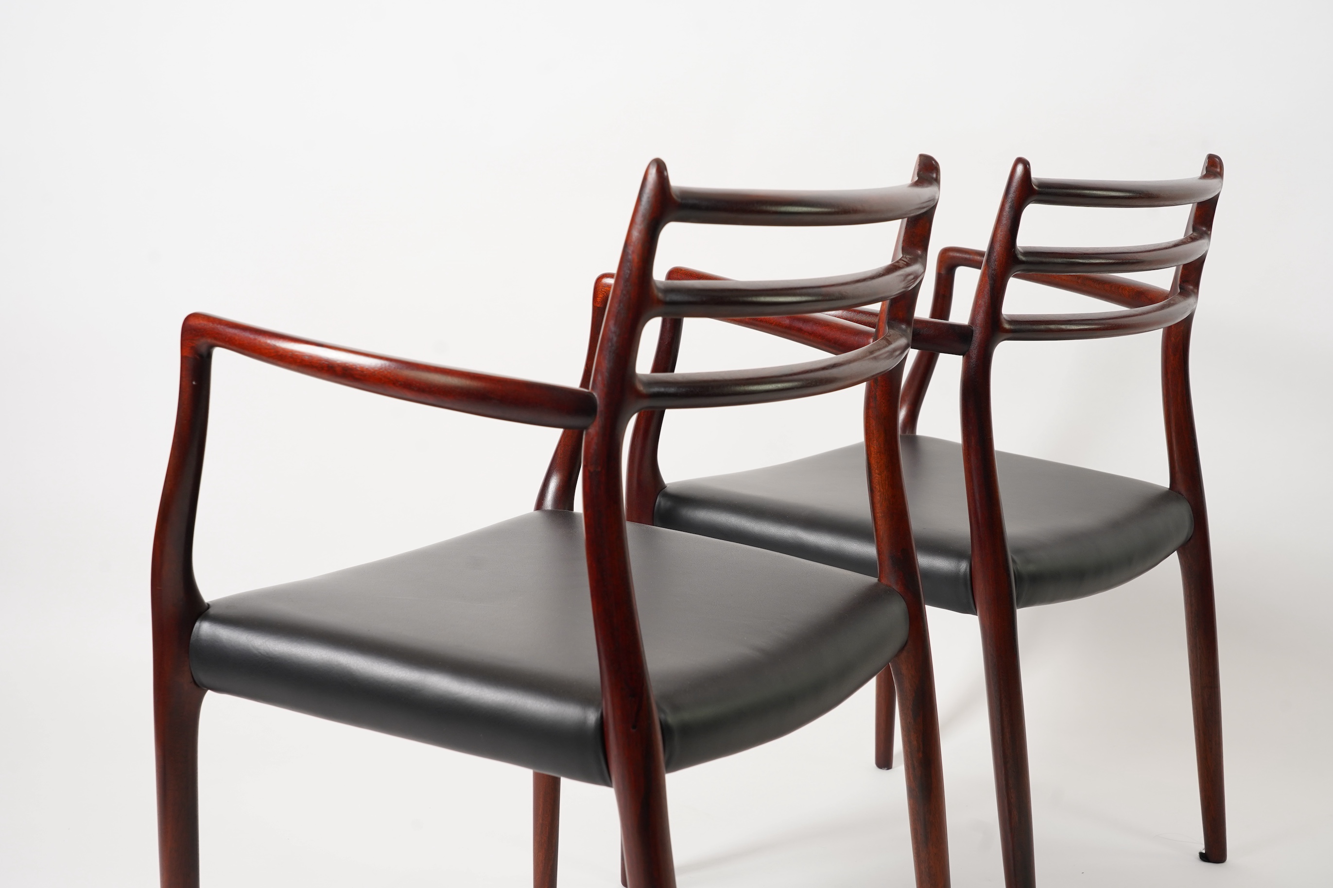 Niels Otto Møller (Danish, 1920-1982) for JL Møllers Møbelfabrik: A pair of 'Model 62' carver chairs